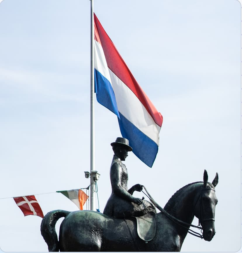The Dutch flag flying above the Wilhelmina statue in Utrecht